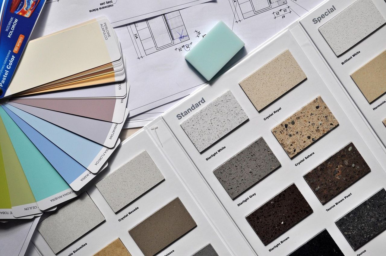 Architect's plans, paint colour chart and worktop samples